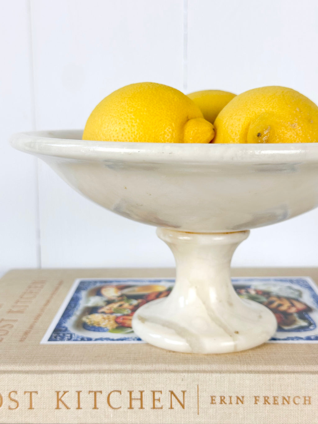 alabaster compote filled with lemons 