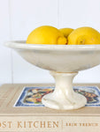 alabaster compote filled with lemons 