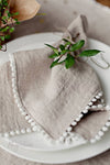 POM POM TRIM LINEN NAPKIN SET (SET OF 2)